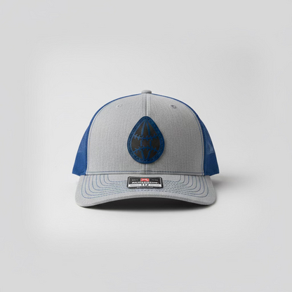 Gray and blue cap with a logo on a light gray background